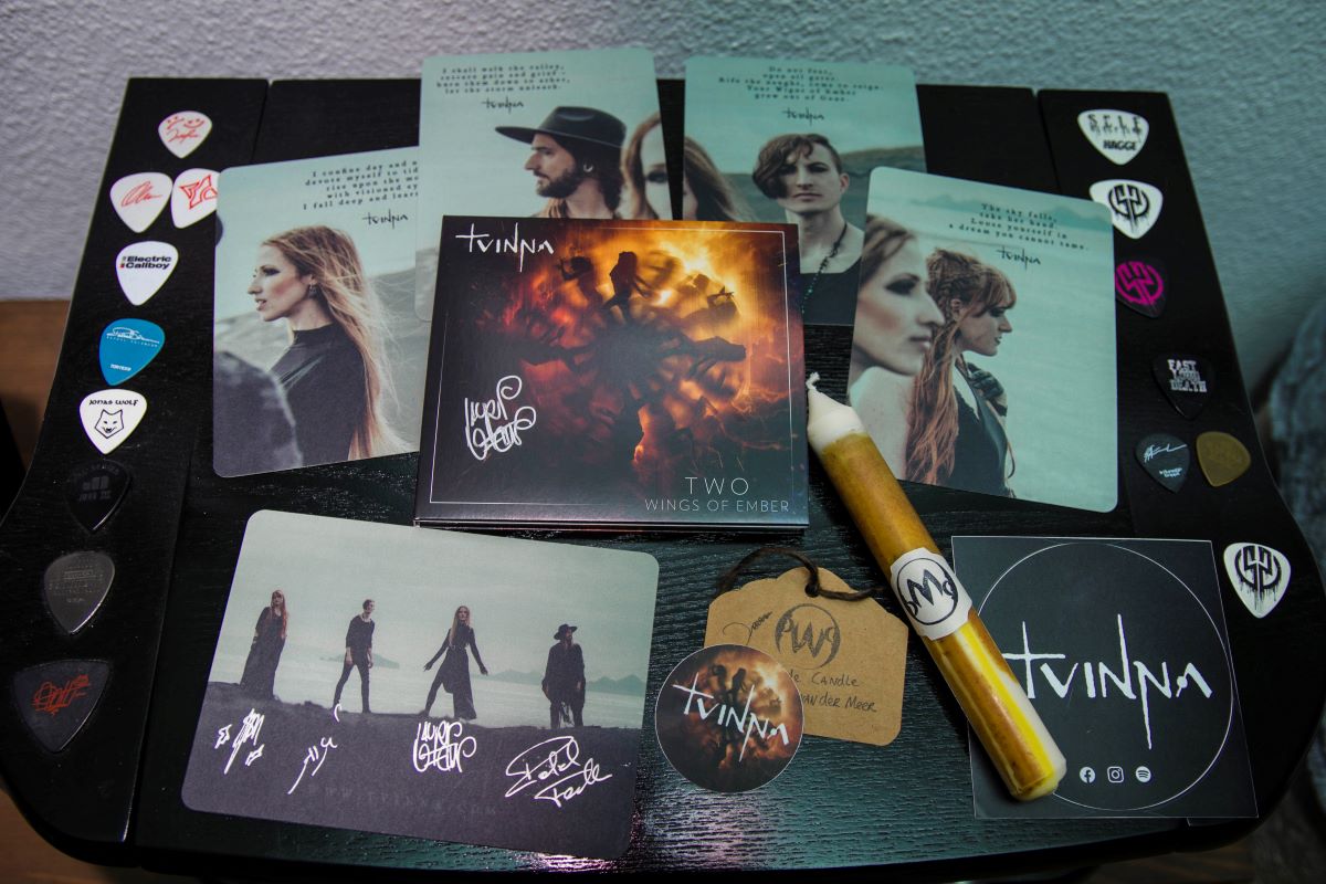 The photo shows all contents of the "Light the Fire" bundle as described in the caption. They're placed on a record player.