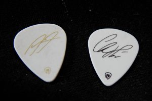 Other side of the two guitar picks with signatures Left: Alex Right: Christian